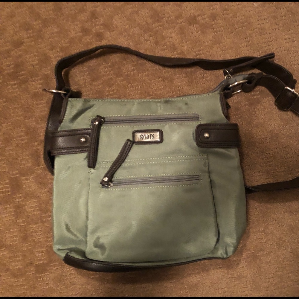 Green crossbody roots purse